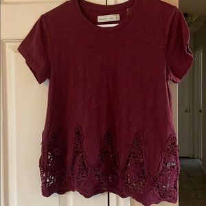 Maroon shirt sleeve with lace detail on bottom